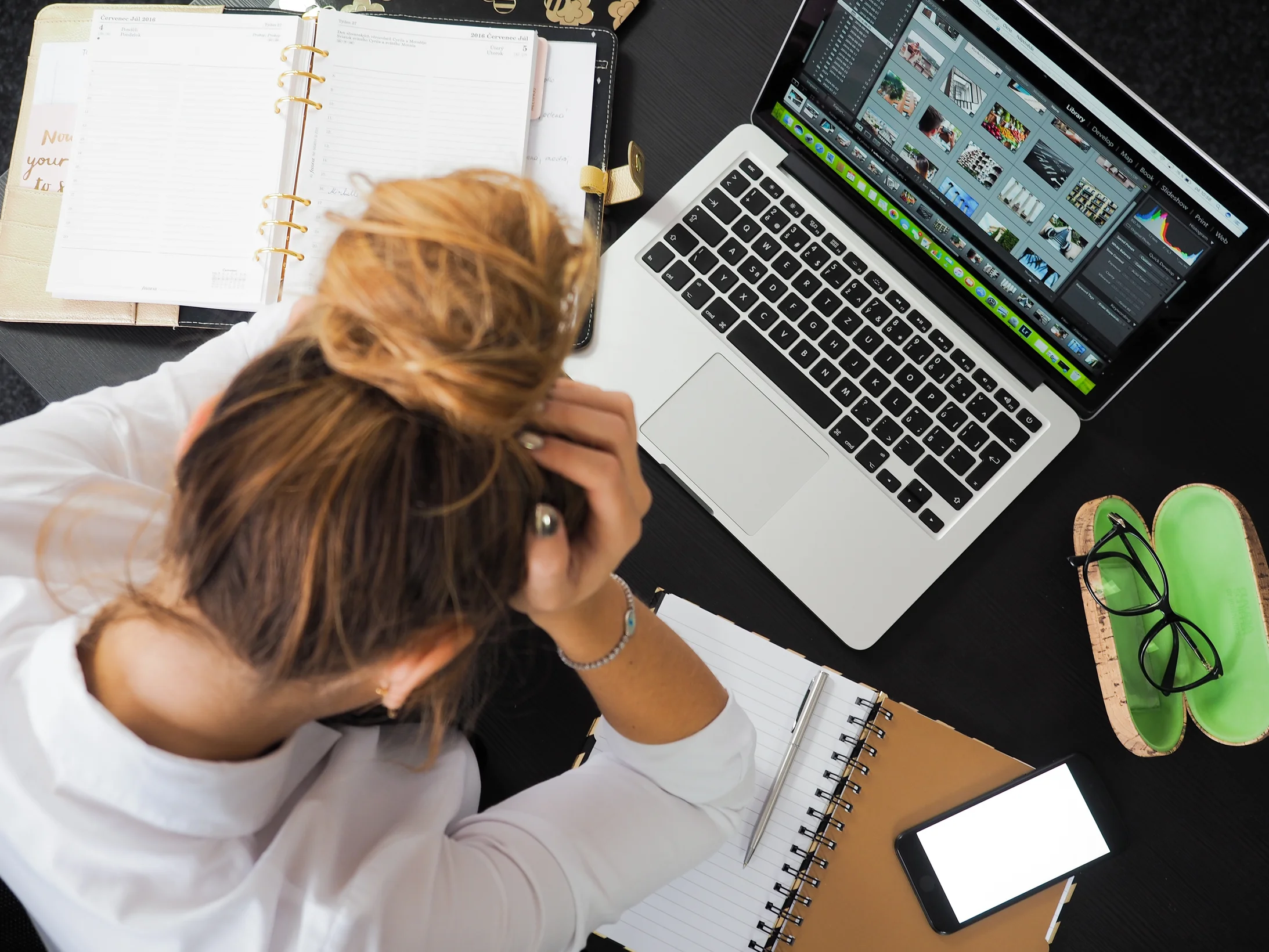 Woman sitting in front of macbook