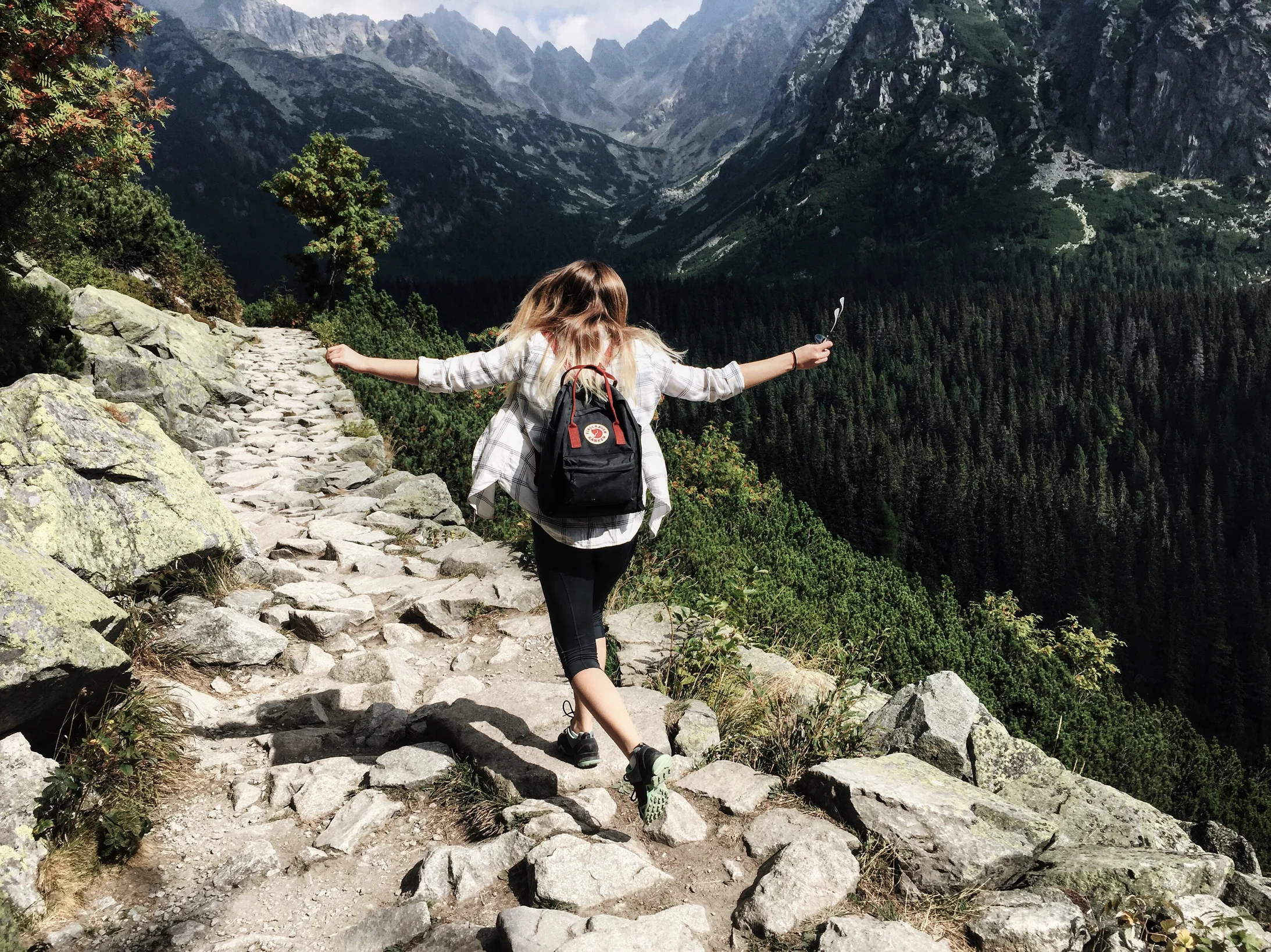 Woman standing on cliff