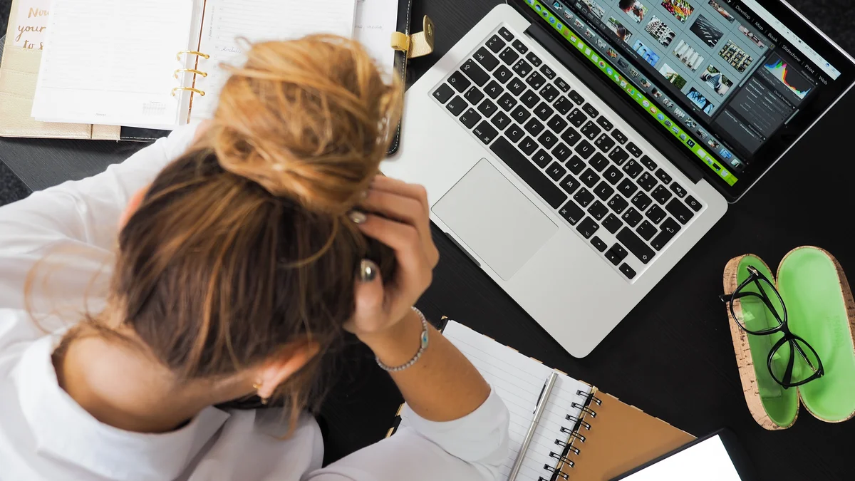 Woman sitting in front of macbook