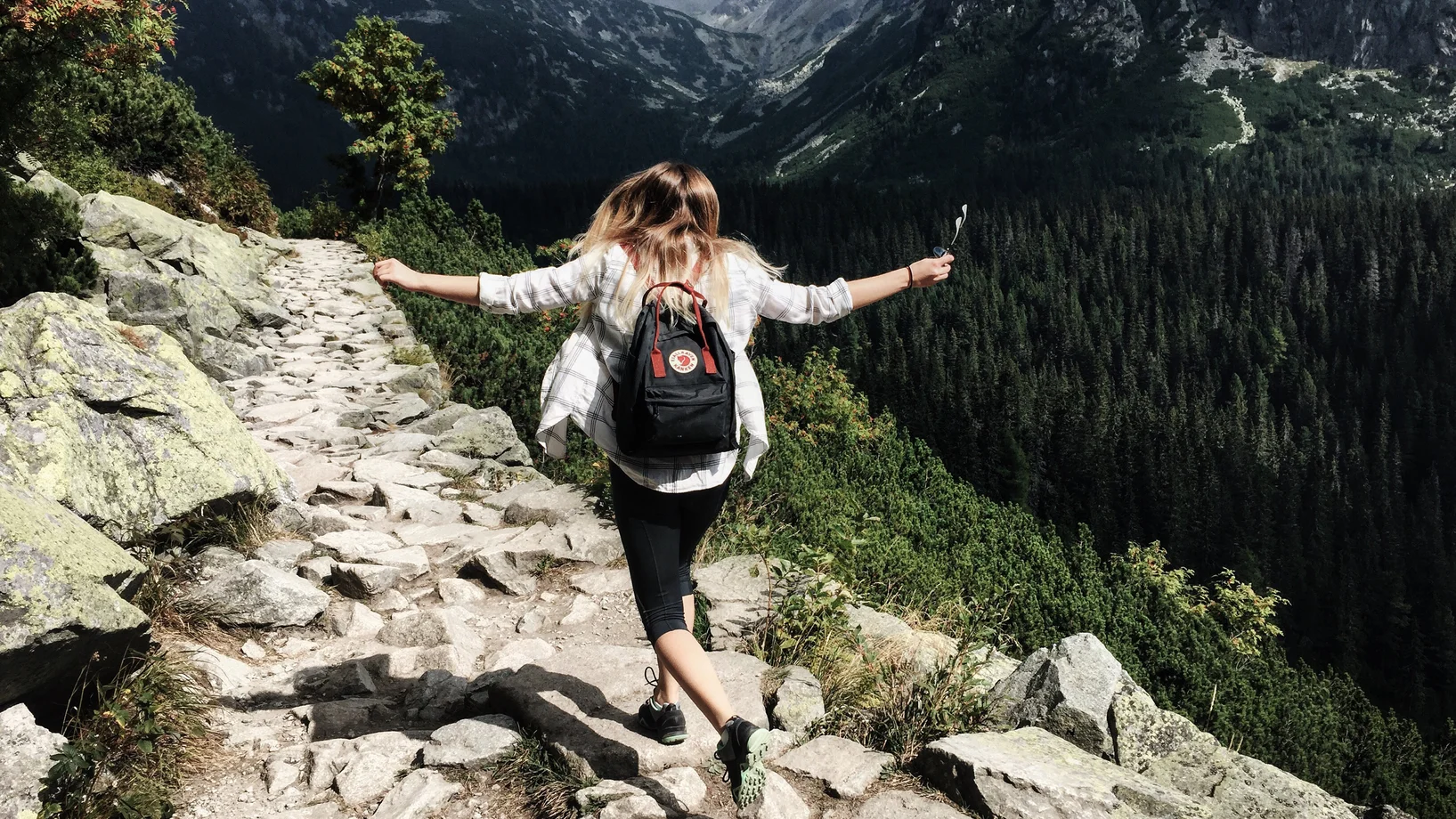 Woman standing on cliff