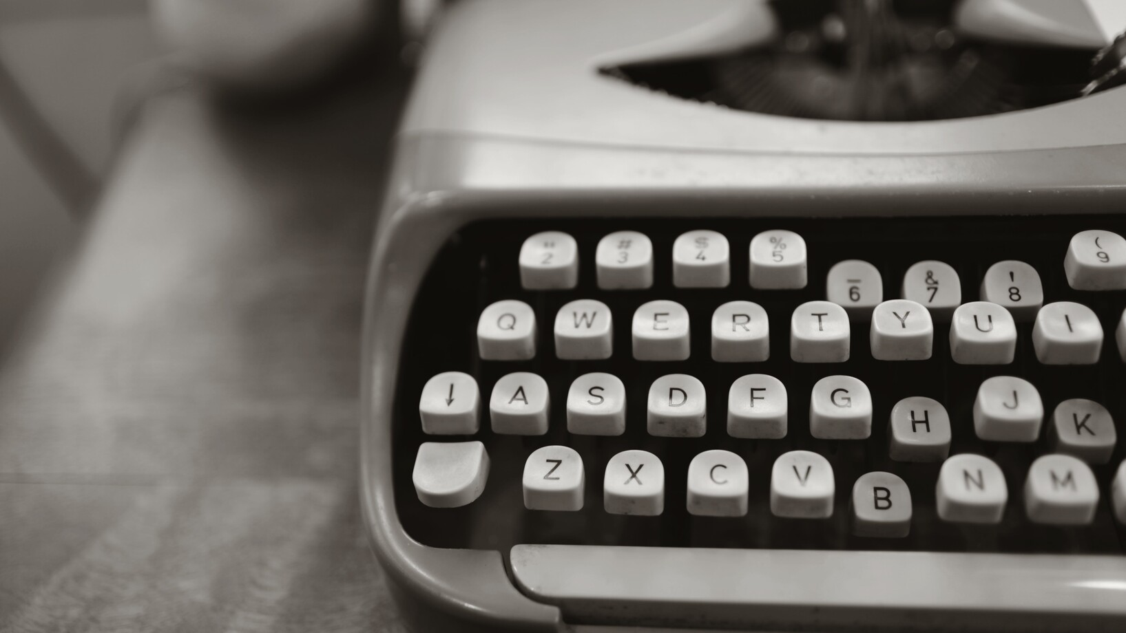 Close up photo of gray typewriter